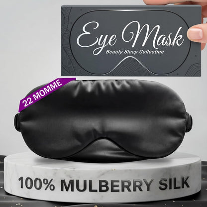 Black sleep mask below a hand holding an Eye Mask box, with printed 22 momme and 100% Mulberry Silk labels.