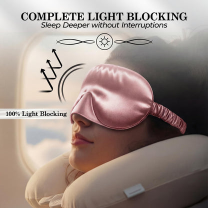 Person reclining with a neck pillow and rose pink sleep mask, with light reflection arrows beneath "Complete Light Blocking".