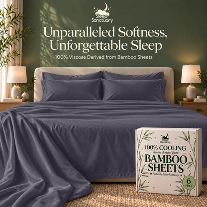 Slate blue sheets and matching pillows on a bed beside a sheet box, beneath the words "Unparalleled Softness, Unforgettable Sleep".