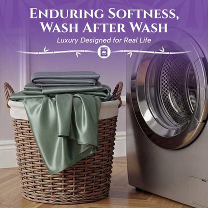 Folded sage green sheets on a wicker basket beside a washing machine, with the words "Enduring Softness, Wash After Wash".