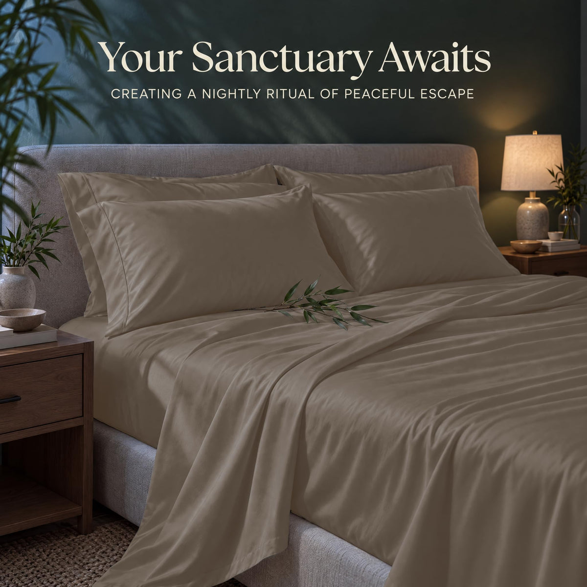 Taupe sheets and matching pillows on a bed beside a lamp, beneath the heading "Your Sanctuary Awaits".