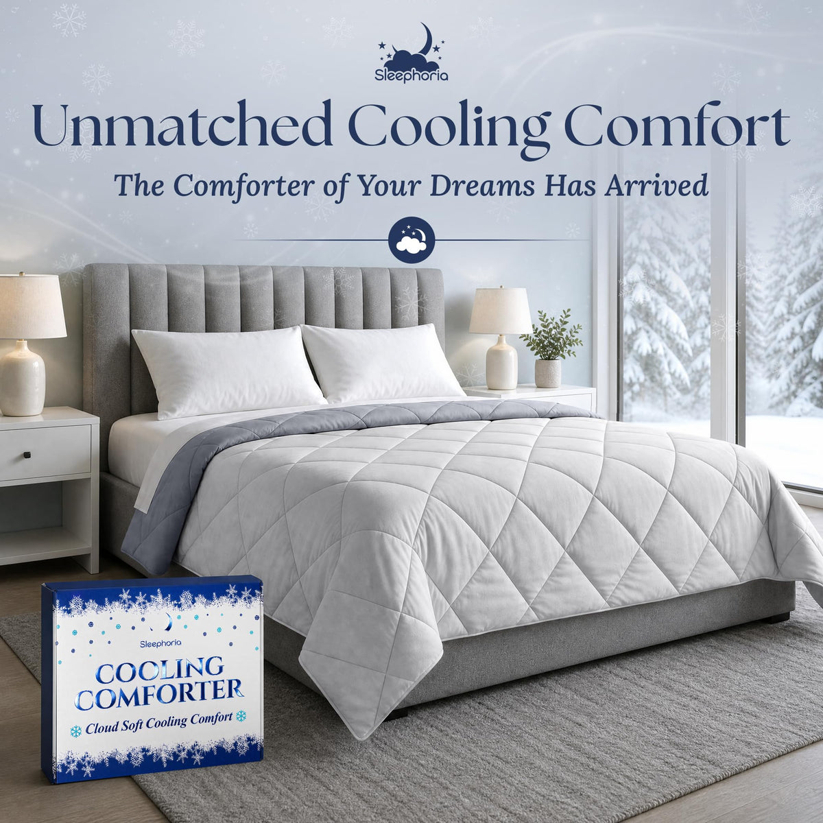 Light gray quilted comforter with a dark gray reverse on a gray upholstered bed, beside Sleephoria packaging.