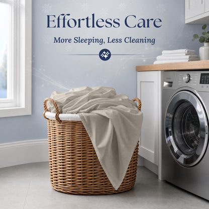 Beige fitted sheet draped over a wicker laundry basket beside a washing machine. Graphic reads "Effortless Care".