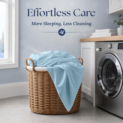 Light blue fitted sheet draped over a wicker laundry basket beside a washing machine. Graphic reads "Effortless Care".