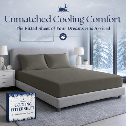 Warm gray fitted sheet pulled over a mattress with two matching pillows on a gray bed, beside Sleephoria packaging.