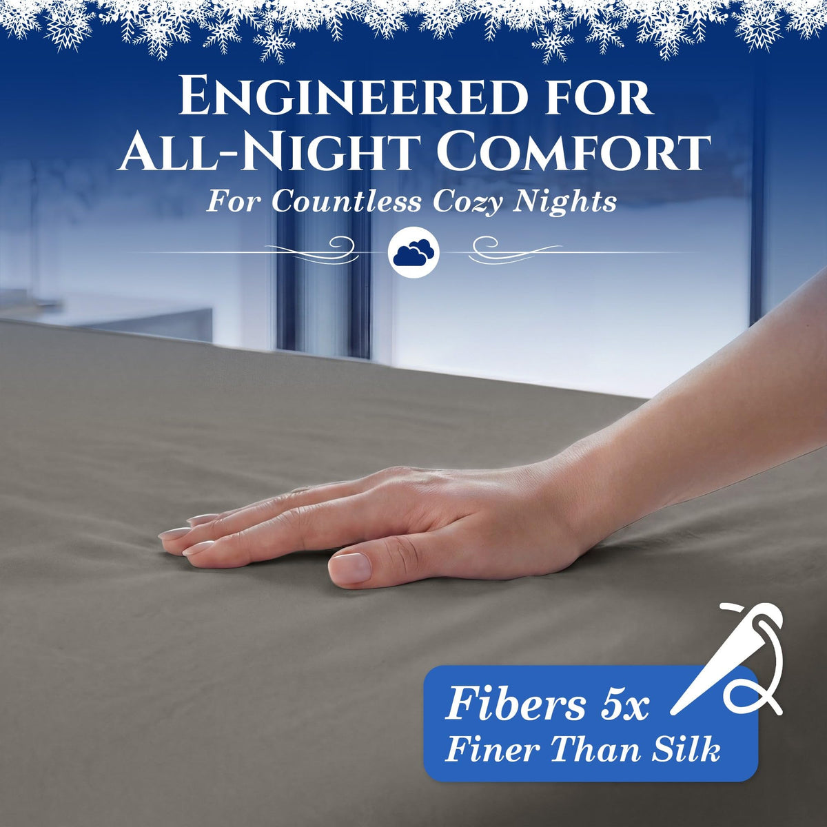 A hand smoothing a warm gray fitted sheet. The graphic reads "Fibers 5x Finer Than Silk".