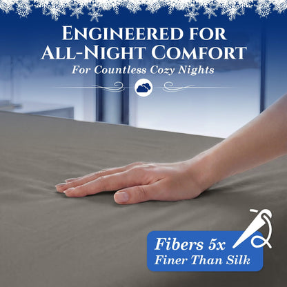 A hand smoothing a warm gray fitted sheet. The graphic reads "Fibers 5x Finer Than Silk".