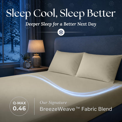 Cream fitted sheet and matching pillows in a dark bedroom, with a blue light trail and BreezeWeave and Q-MAX 0.46 labels.