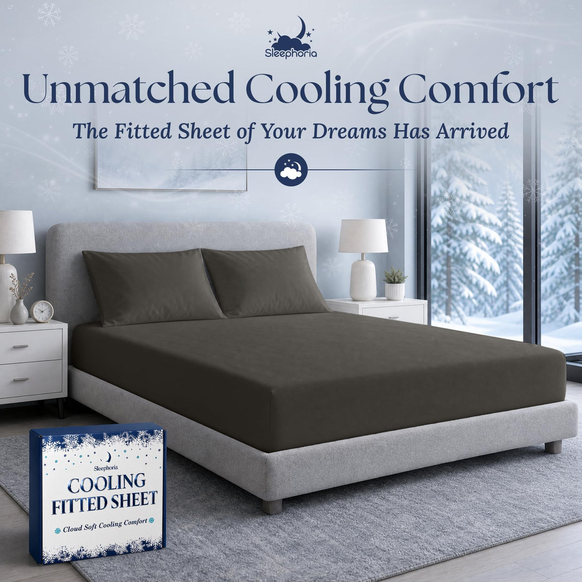 Charcoal gray fitted sheet pulled over a mattress with two matching pillows on a gray bed, beside Sleephoria packaging.