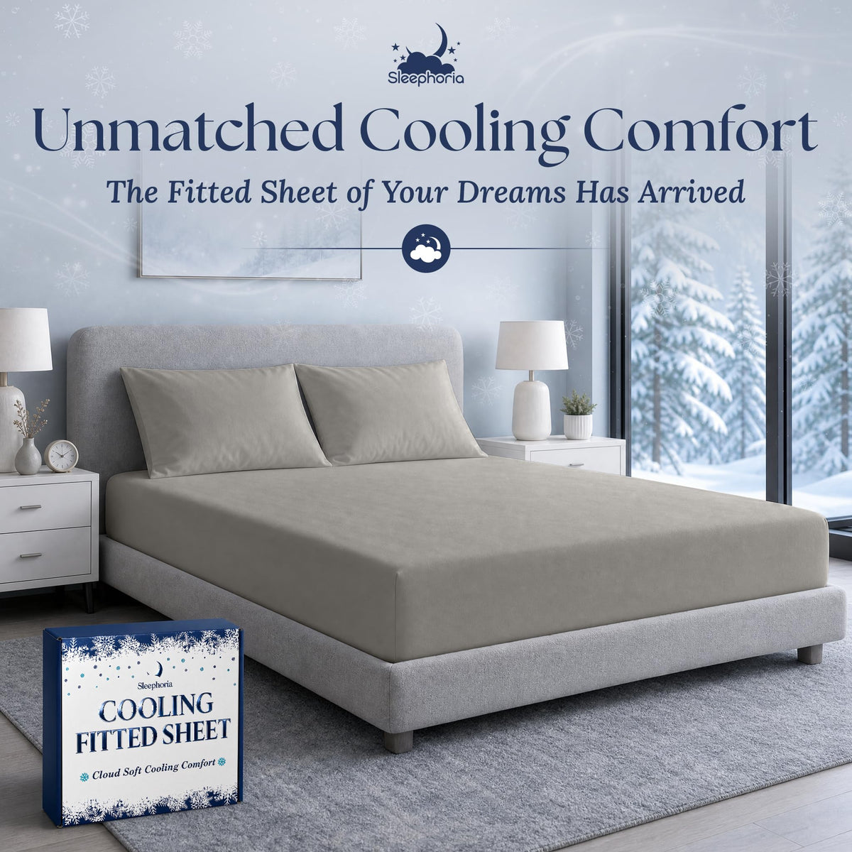 Light gray fitted sheet pulled over a mattress with two matching pillows on a gray bed, beside Sleephoria packaging.