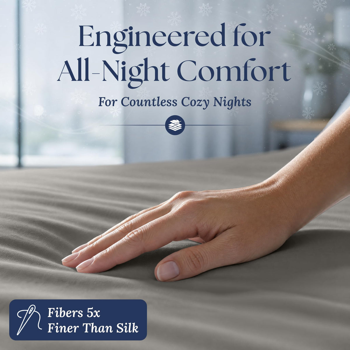 A hand smoothing a light gray fitted sheet. The graphic reads "Fibers 5x Finer Than Silk".