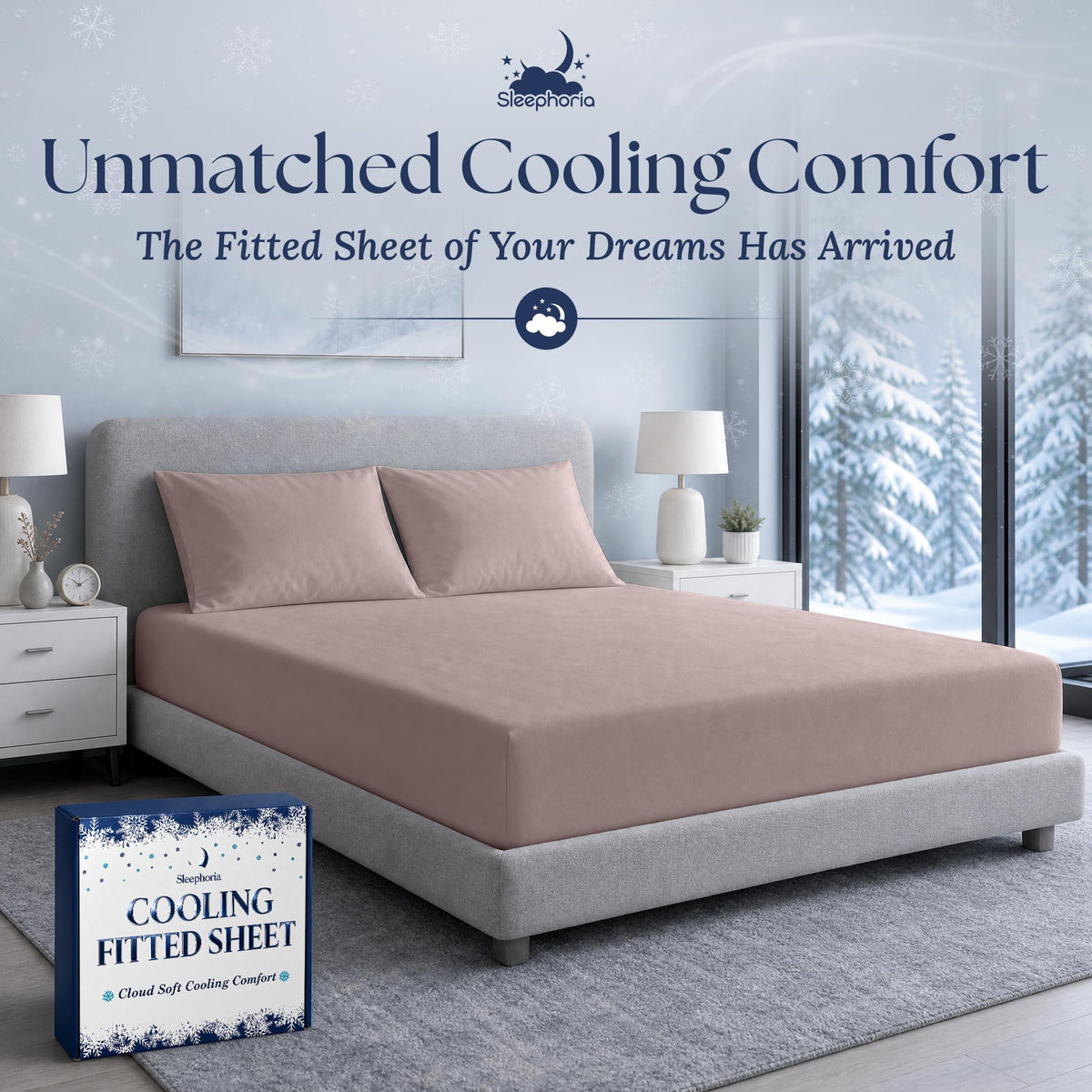 Blush pink fitted sheet pulled over a mattress with two matching pillows on a gray bed, beside Sleephoria packaging.