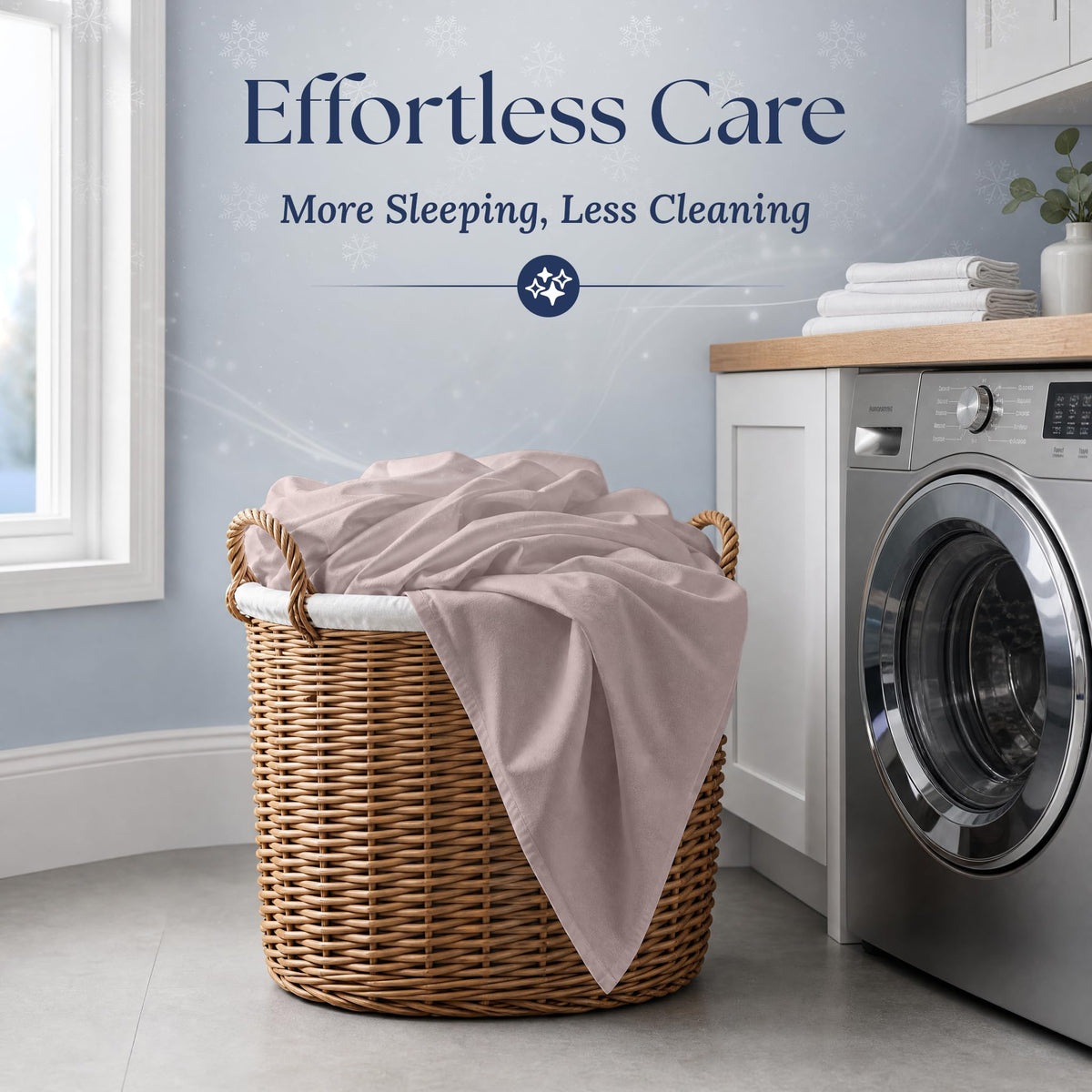 Blush pink fitted sheet draped over a wicker laundry basket beside a washing machine. Graphic reads "Effortless Care".