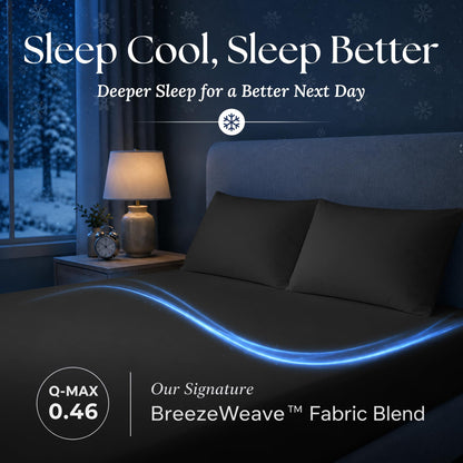 Black fitted sheet and matching pillows in a dark bedroom, with a blue light trail and BreezeWeave and Q-MAX 0.46 labels.