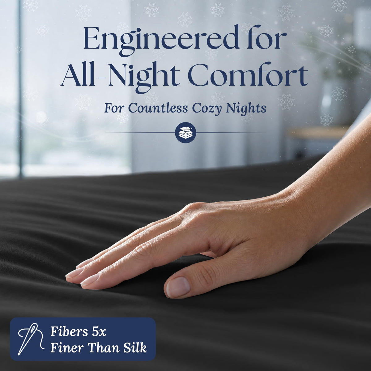 A hand smoothing a black fitted sheet. The graphic reads "Fibers 5x Finer Than Silk".