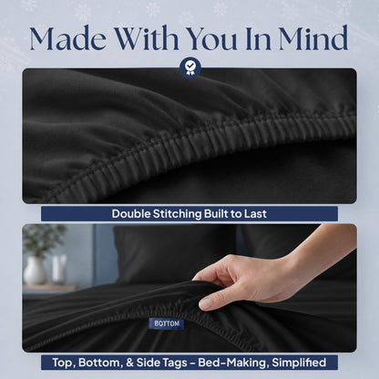 Black fitted sheet details showing double stitching along the elastic edge and a hand holding the "BOTTOM" orientation tag.