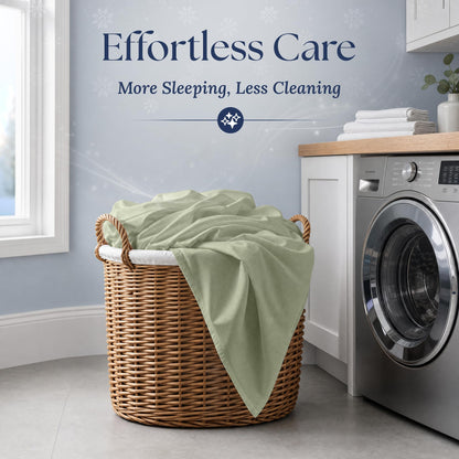 Sage green fitted sheet draped over a wicker laundry basket beside a washing machine. Graphic reads "Effortless Care".
