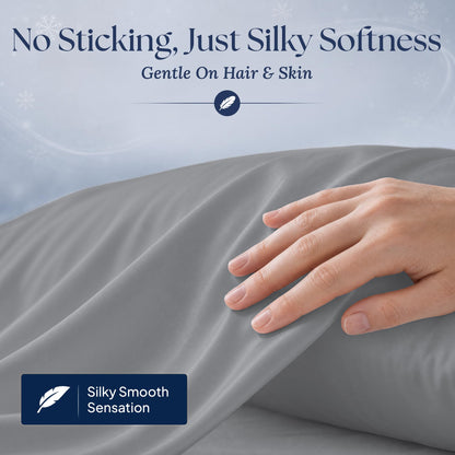 A hand gliding over a dark gray pillowcase. Graphic reads "No Sticking, Just Silky Softness" and "Gentle On Hair & Skin".