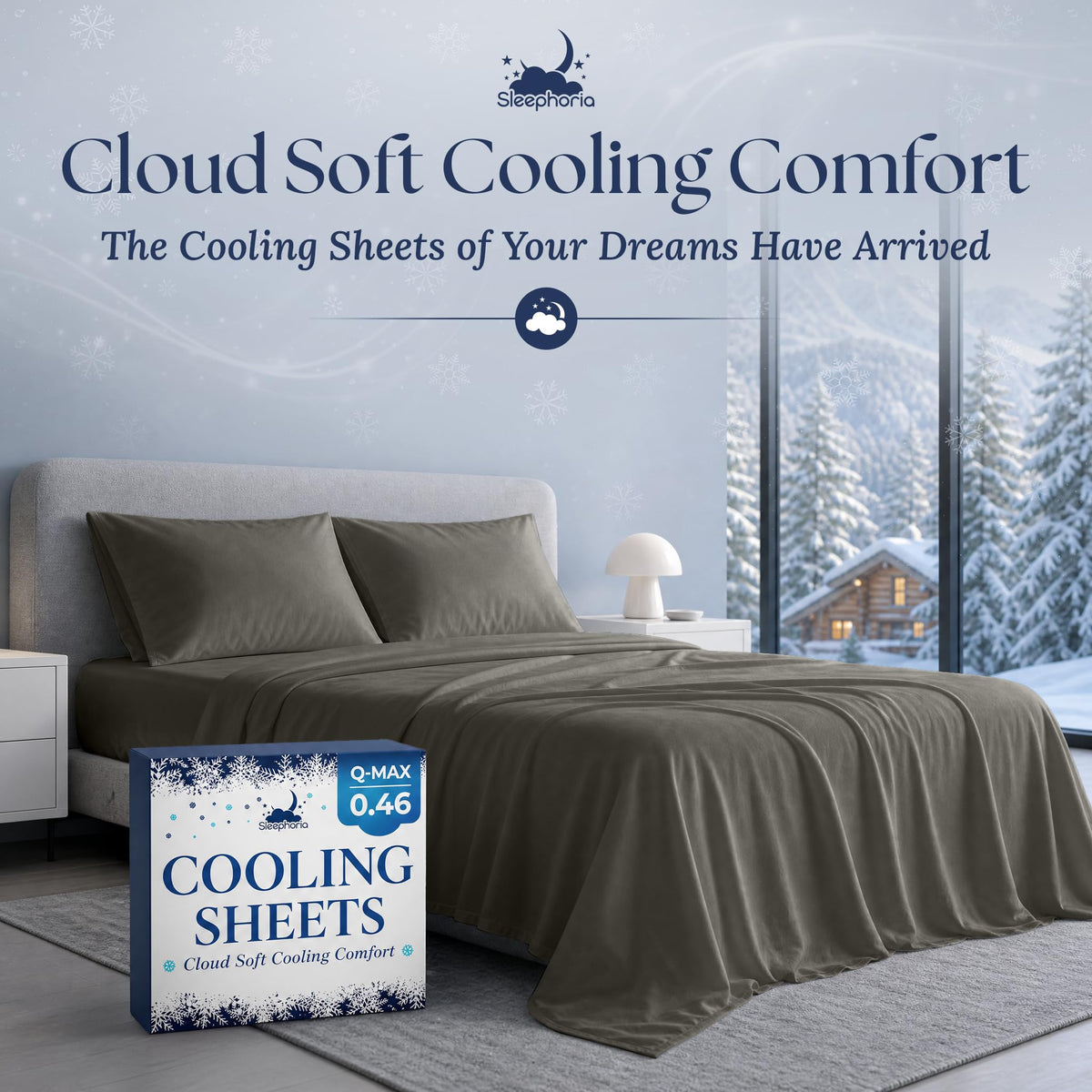 Dark gray sheets and two matching pillows on a gray bed beside Sleephoria Cooling Sheets packaging, with snowy trees outside.