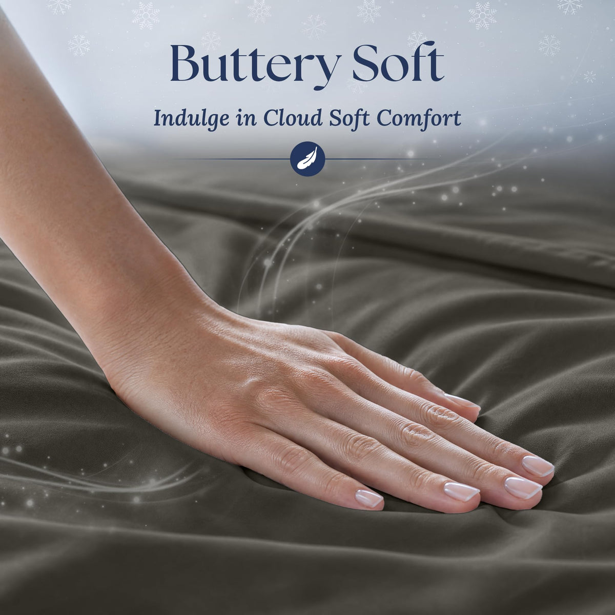 A hand smoothing dark gray fabric with a soft sheen. Graphic reads "Buttery Soft".