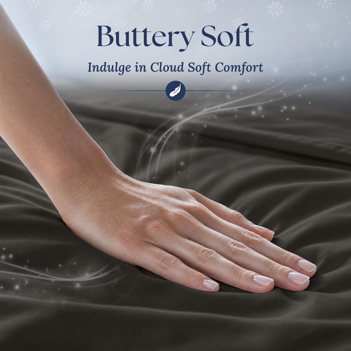 A hand smoothing charcoal gray fabric with a soft sheen. Graphic reads "Buttery Soft".