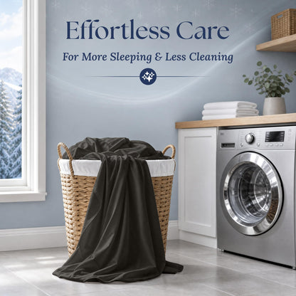 Charcoal gray sheets draped over a wicker laundry basket beside a washing machine. Graphic reads "Effortless Care".