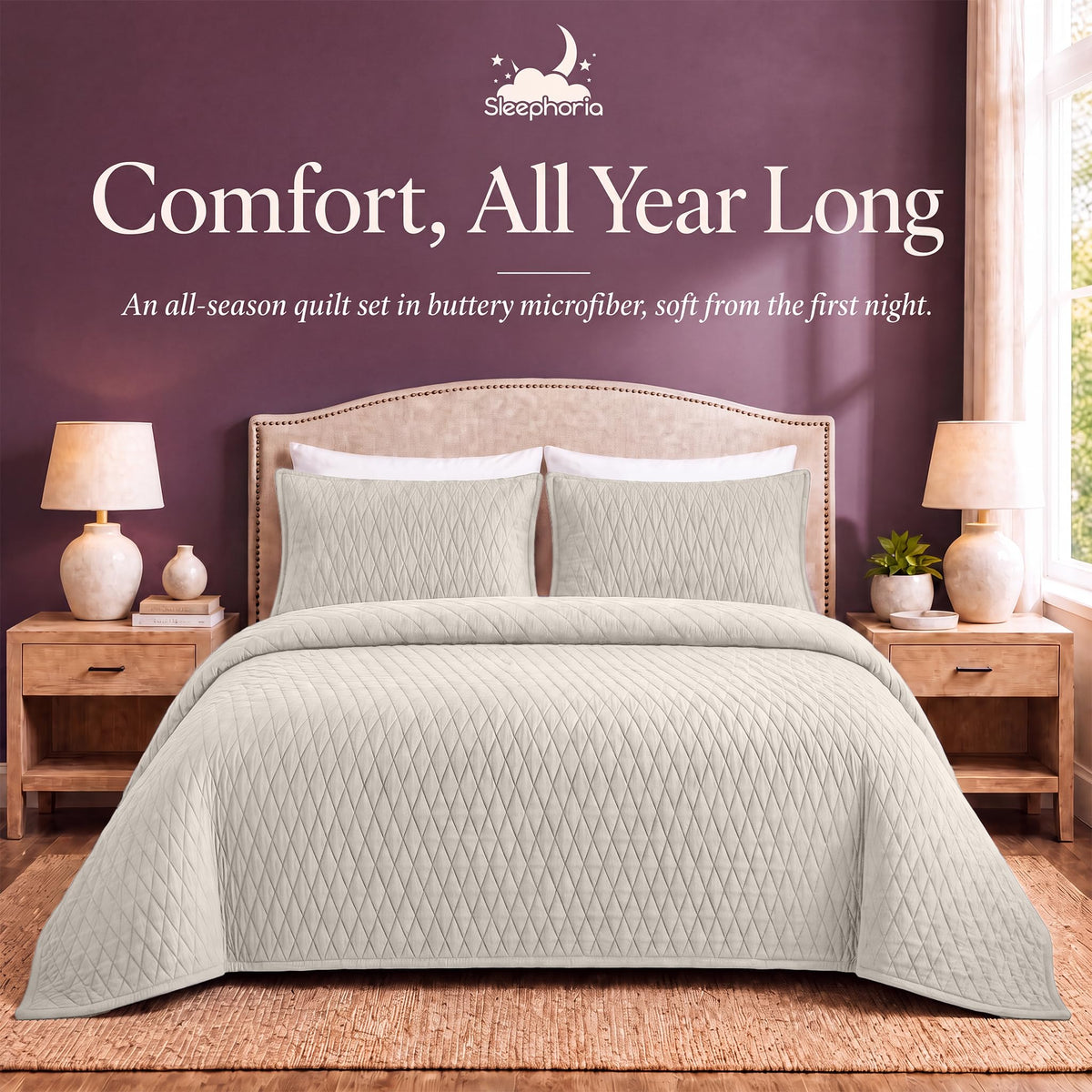 Ivory diamond quilt and matching shams on a bed between wooden nightstands beneath "Comfort, All Year Long".