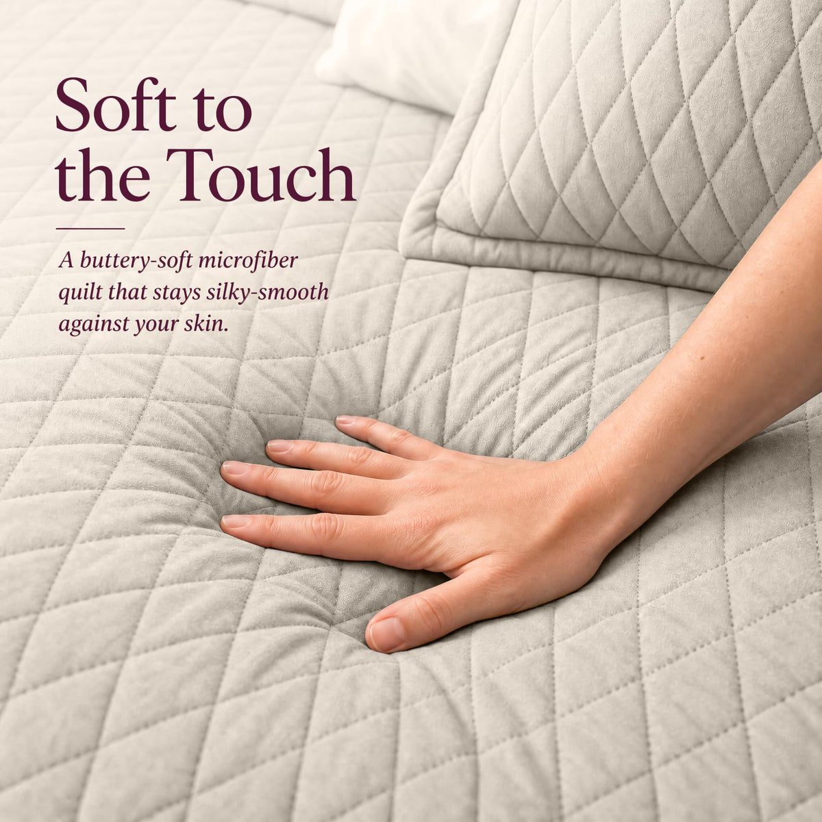 Hand touching a ivory diamond stitched quilt beside matching shams beneath "Soft to the Touch".