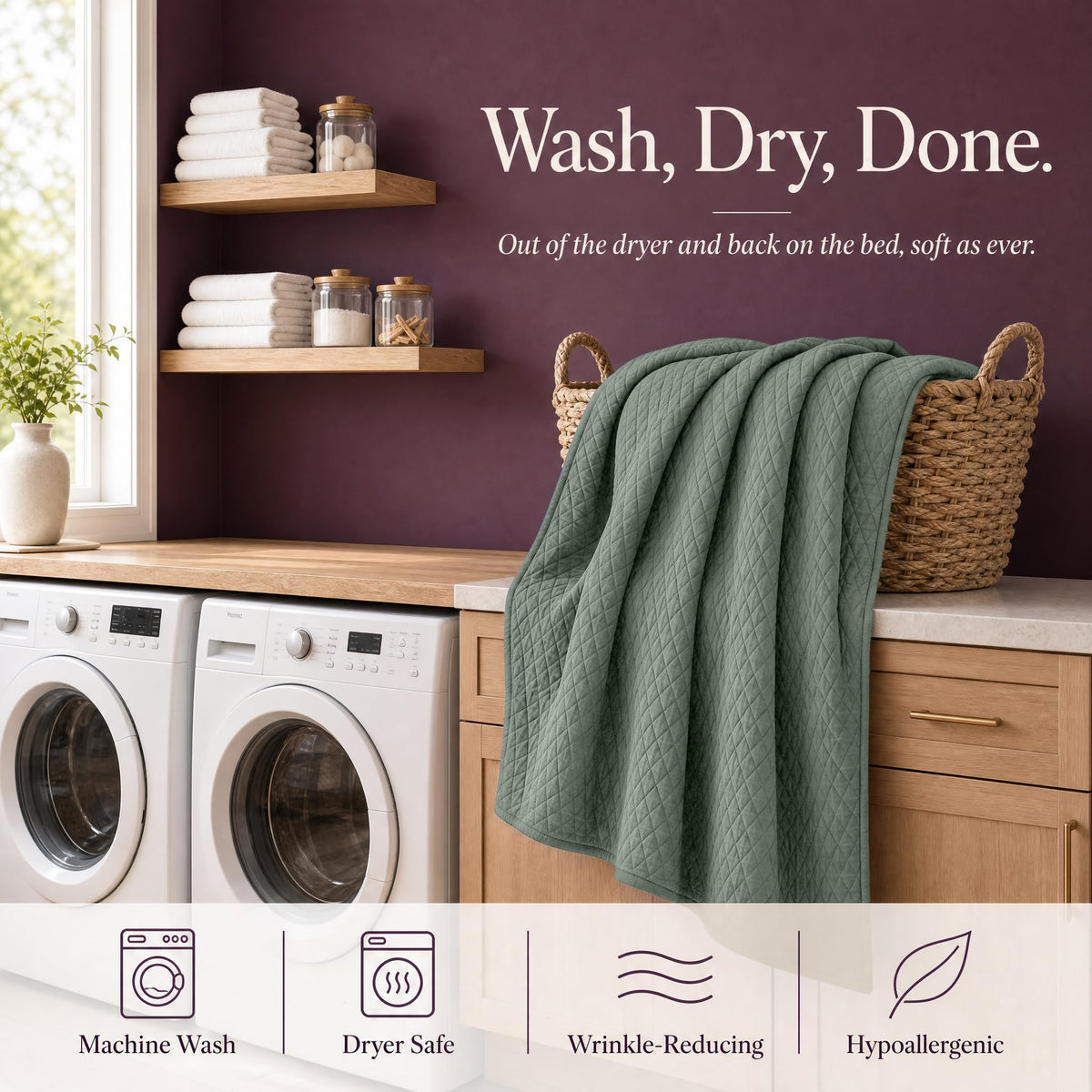 Sage green quilt draped over a wicker basket above laundry machines beneath "Wash, Dry, Done".