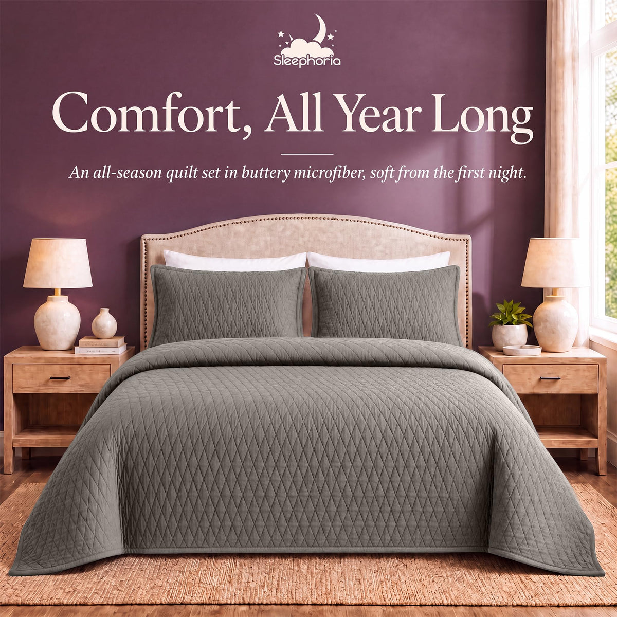 Taupe diamond quilt and matching shams on a bed between wooden nightstands beneath "Comfort, All Year Long".