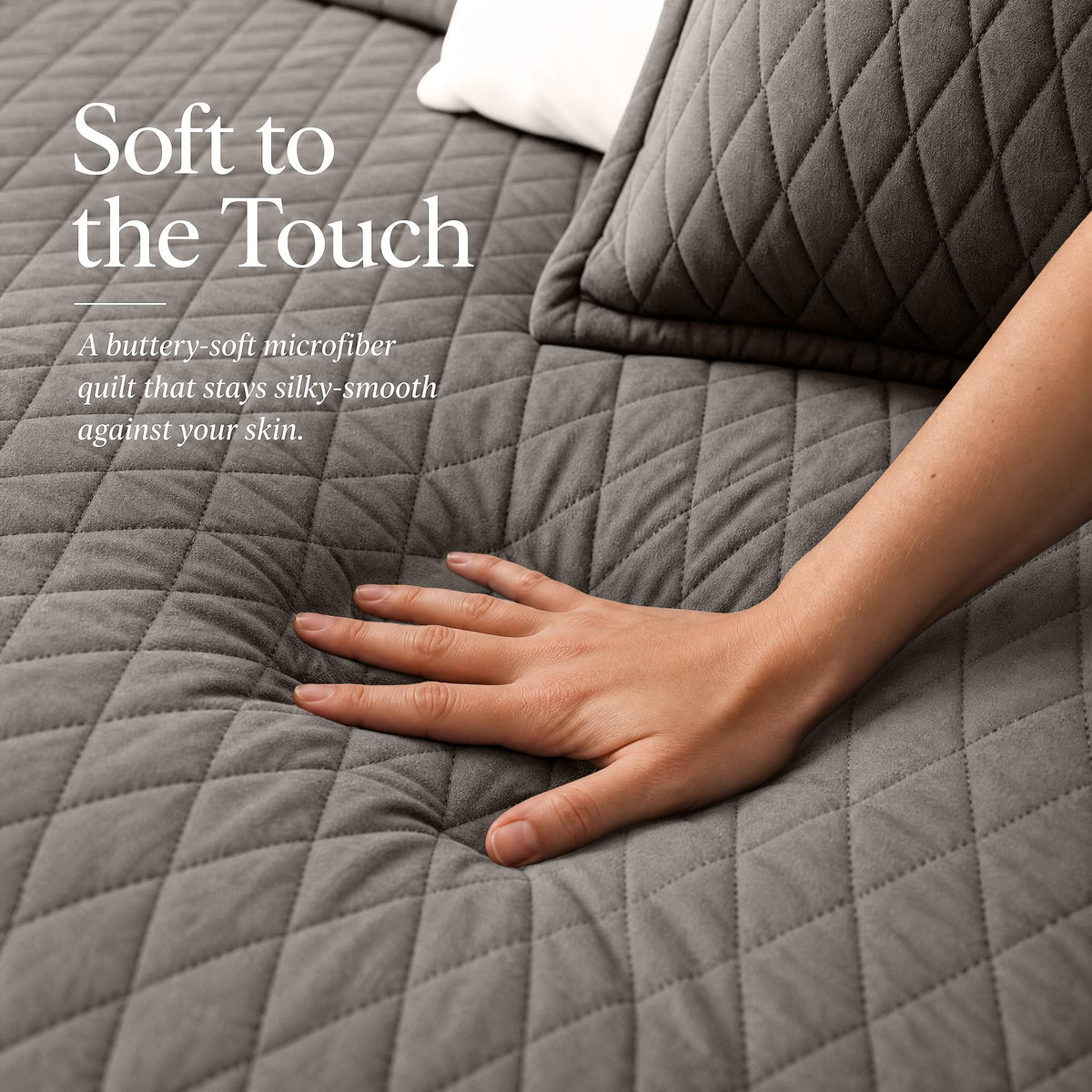Hand touching a taupe diamond stitched quilt beside matching shams beneath "Soft to the Touch".