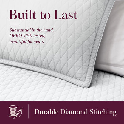Close-up of white diamond stitching on a quilt and sham beneath "Built to Last" and above "Durable Diamond Stitching".