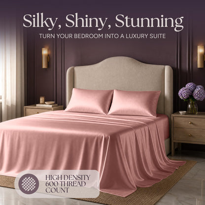 Rose pink satin bedding on an upholstered bed beneath "Silky, Shiny, Stunning", with a printed 600 thread count label.