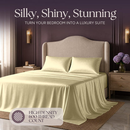 Pale yellow satin bedding on an upholstered bed beneath "Silky, Shiny, Stunning", with a printed 600 thread count label.