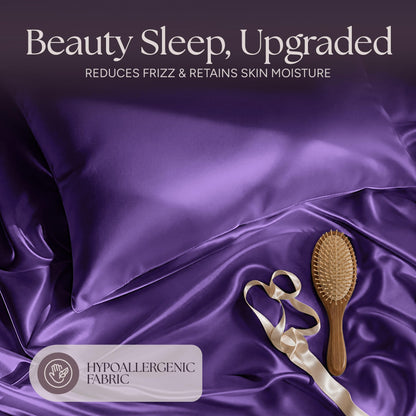 Purple satin pillow and rumpled fabric with a wooden hairbrush and ribbon beneath "Beauty Sleep, Upgraded".