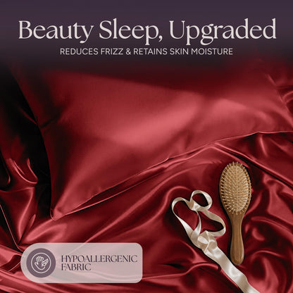Red satin pillow and rumpled fabric with a wooden hairbrush and ribbon beneath "Beauty Sleep, Upgraded".