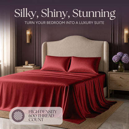 Red satin bedding on an upholstered bed beneath "Silky, Shiny, Stunning", with a printed 600 thread count label.