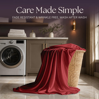 Red satin fabric draped over a wicker laundry basket beside a washing machine beneath "Care Made Simple".