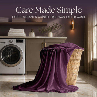 Plum satin fabric draped over a wicker laundry basket beside a washing machine beneath "Care Made Simple".
