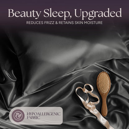 Dark gray satin pillow and rumpled fabric with a wooden hairbrush and ribbon beneath "Beauty Sleep, Upgraded".