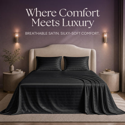 Black striped satin sheets and two matching pillows on a bed beneath "Where Comfort Meets Luxury".