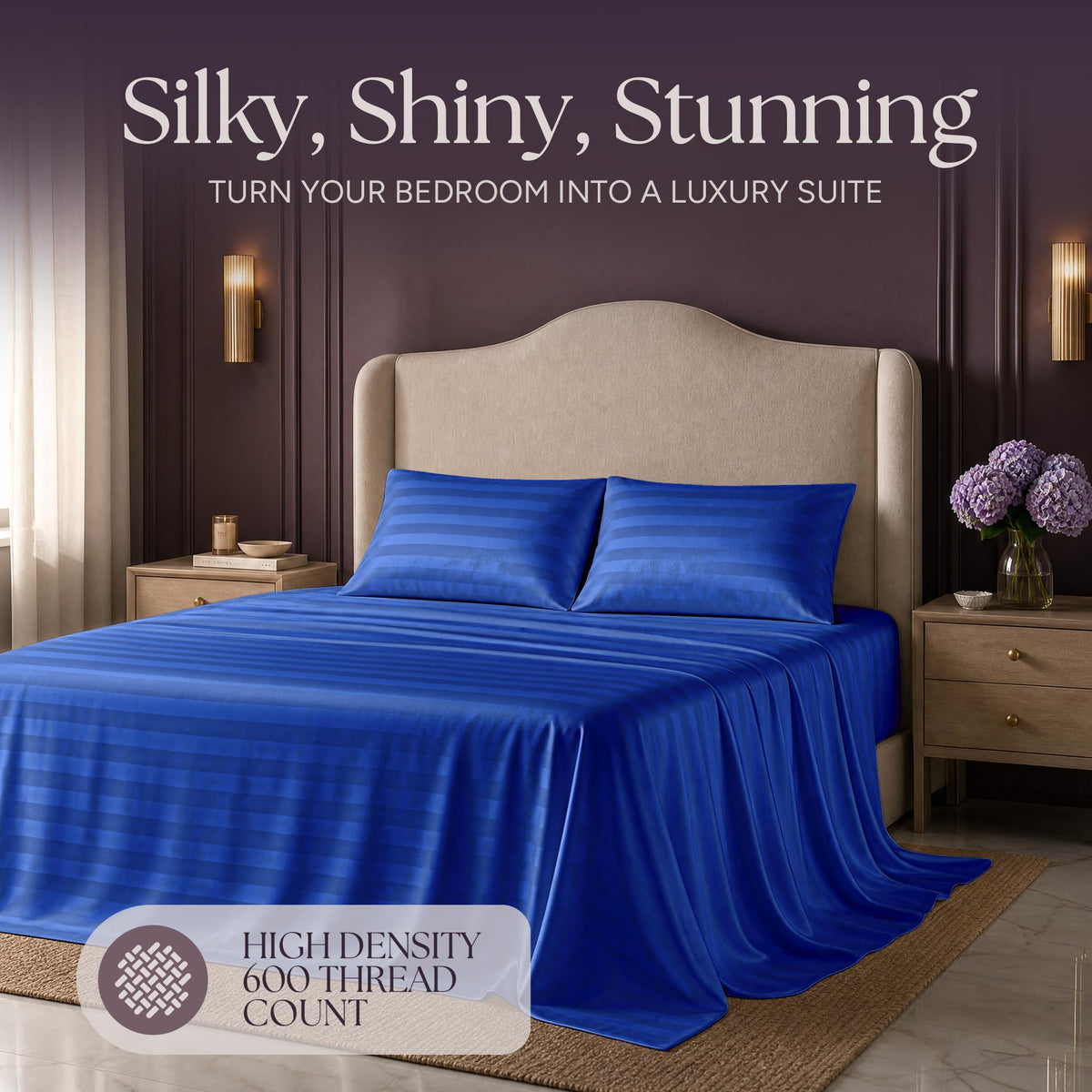 Royal blue striped satin bedding on an upholstered bed beneath "Silky, Shiny, Stunning", with a printed 600 thread count label.