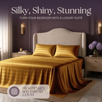 Gold striped satin bedding on an upholstered bed beneath "Silky, Shiny, Stunning", with a printed 600 thread count label.