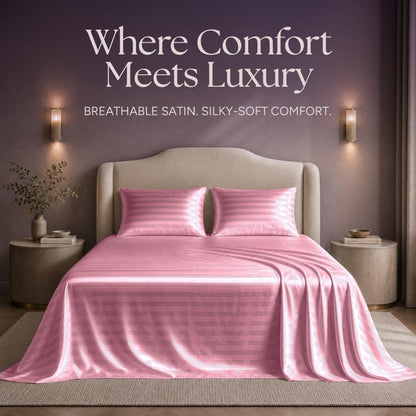 Pink striped satin sheets and two matching pillows on a bed beneath "Where Comfort Meets Luxury".