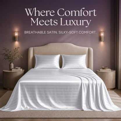 White striped satin sheets and two matching pillows on a bed beneath "Where Comfort Meets Luxury".