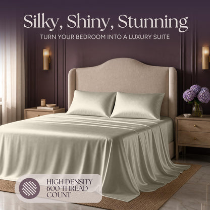 Ivory satin bedding on an upholstered bed beneath "Silky, Shiny, Stunning", with a printed 600 thread count label.