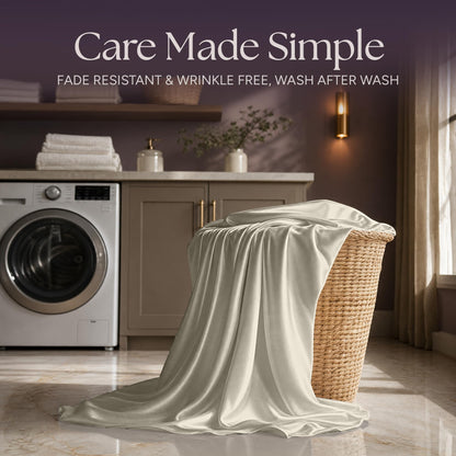 Ivory satin fabric draped over a wicker laundry basket beside a washing machine beneath "Care Made Simple".