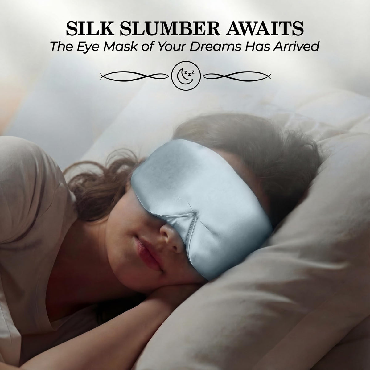 Person sleeping on their side wearing a pale blue wide sleep mask beneath "Silk Slumber Awaits".