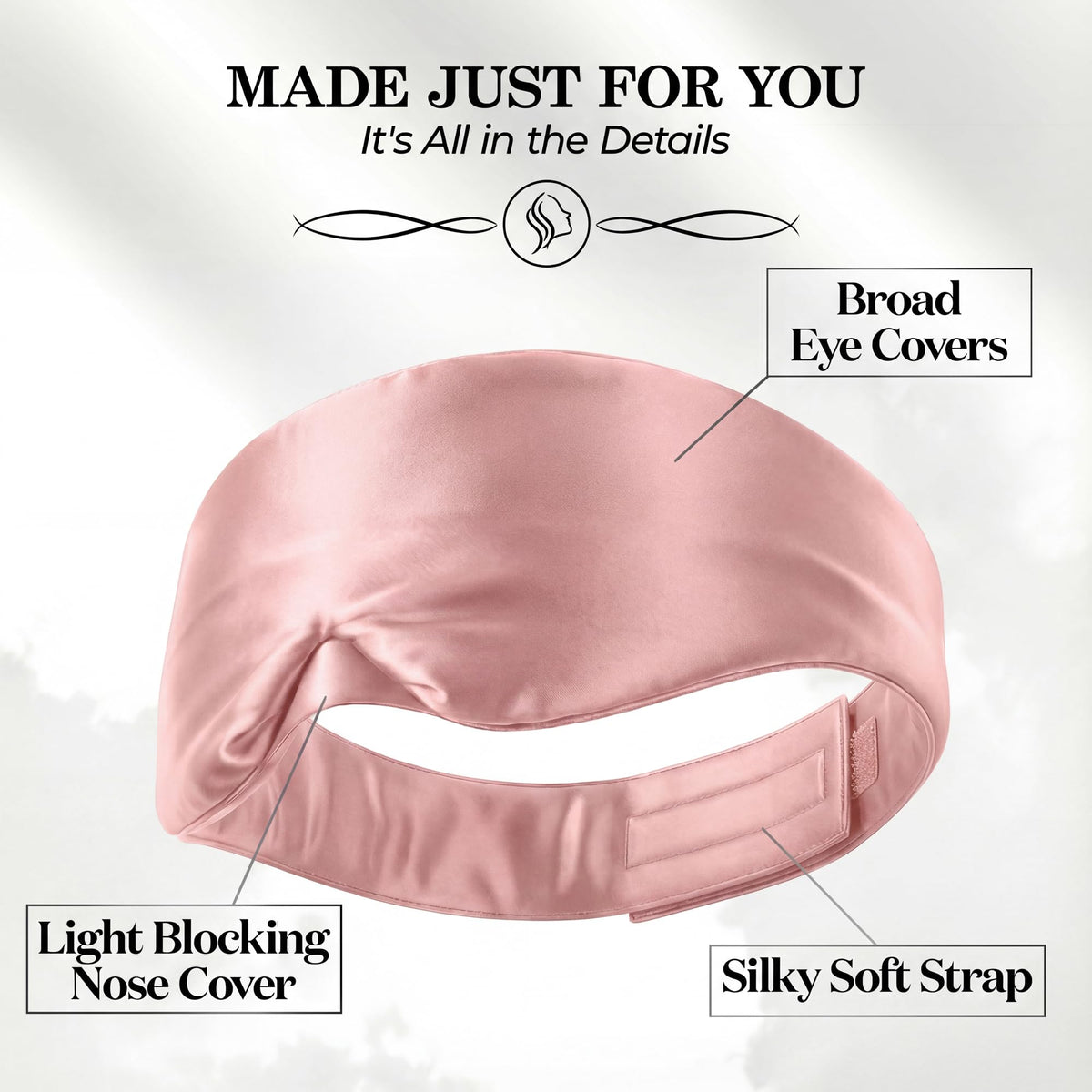 Pink wide sleep mask viewed from behind, with labels pointing to broad eye covers, nose cover and adjustable fastening strap.