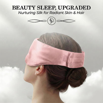 Side and rear view of a person wearing a pink sleep mask with a wide adjustable fastening strap beneath "Beauty Sleep, Upgraded".